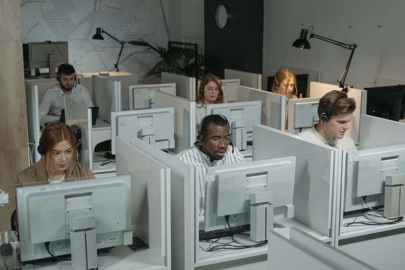 Rows of workstations with team members at work across a GCC office floor