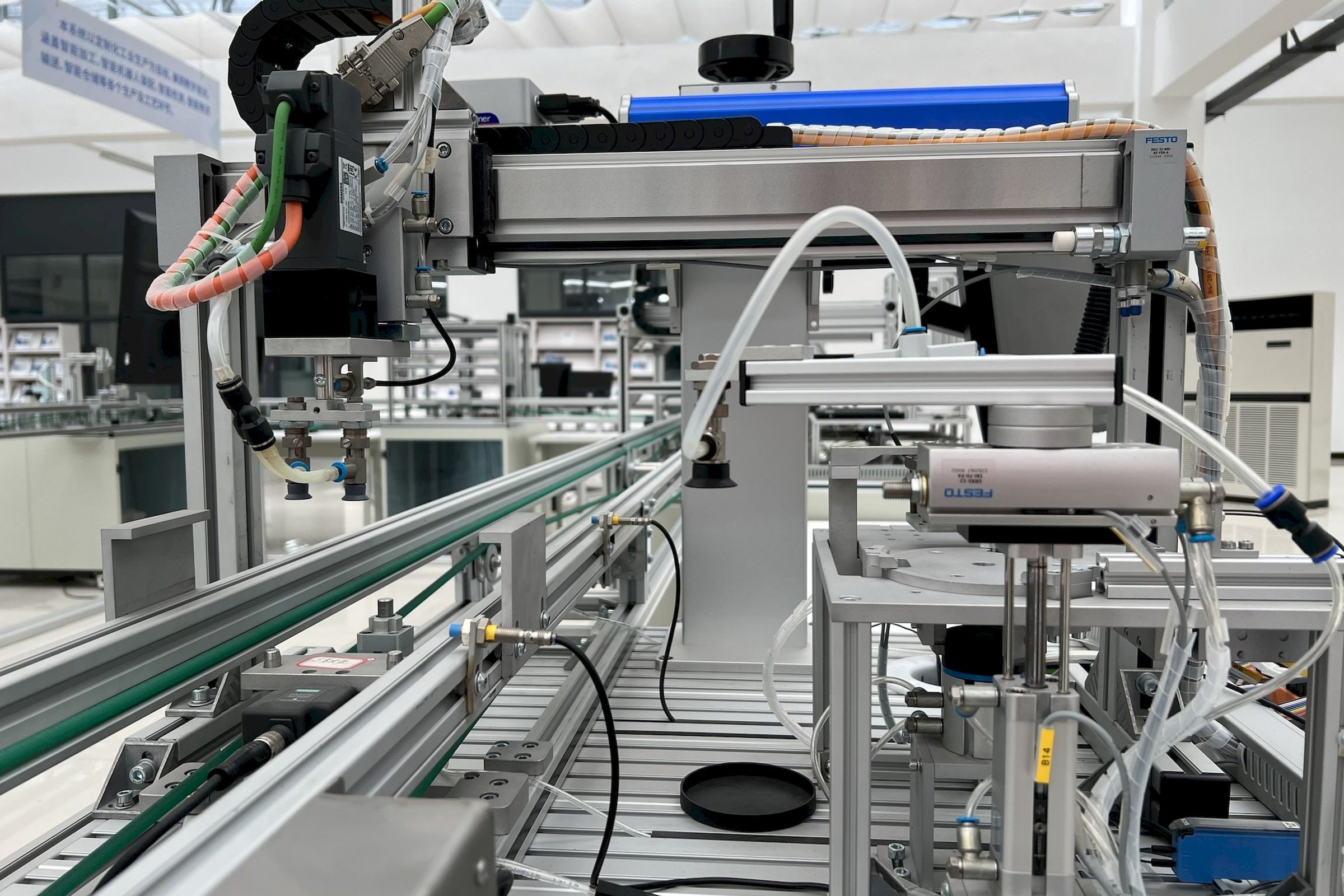 Automated inspection station with sensors and controllers on a production line