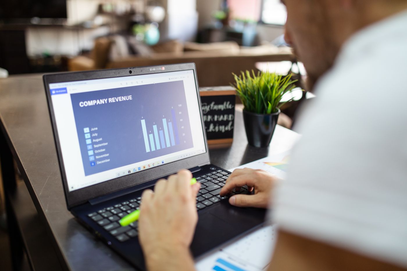 Marketer reviewing campaign conversion data on a laptop