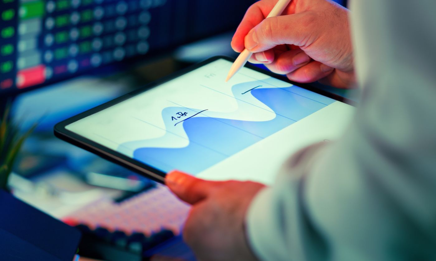 Analyst reviewing predictive insights on a tablet