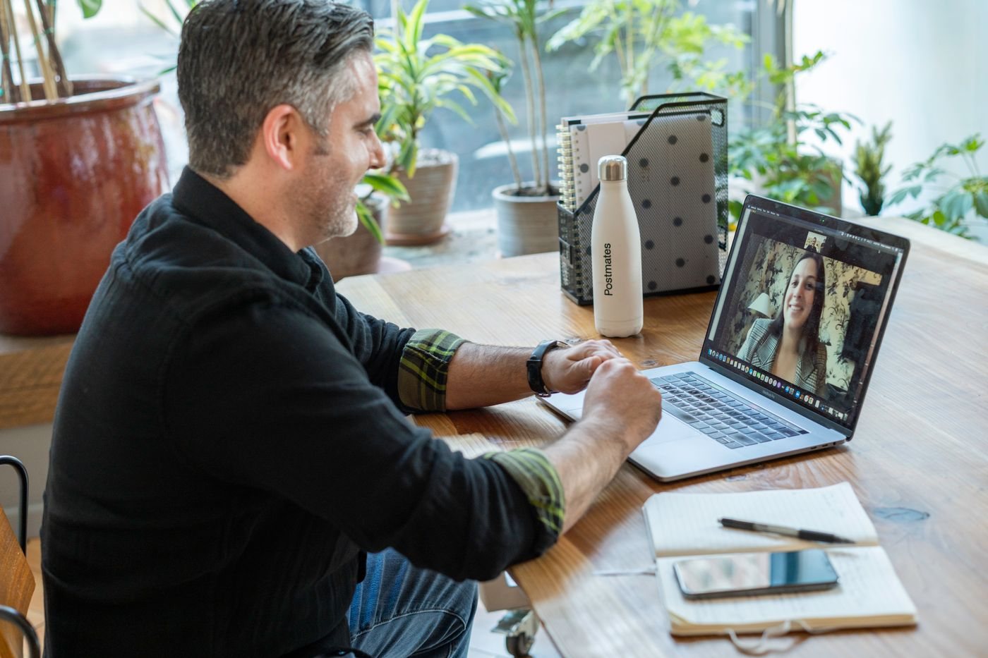 Account executive on a video call with a customer in a bright office