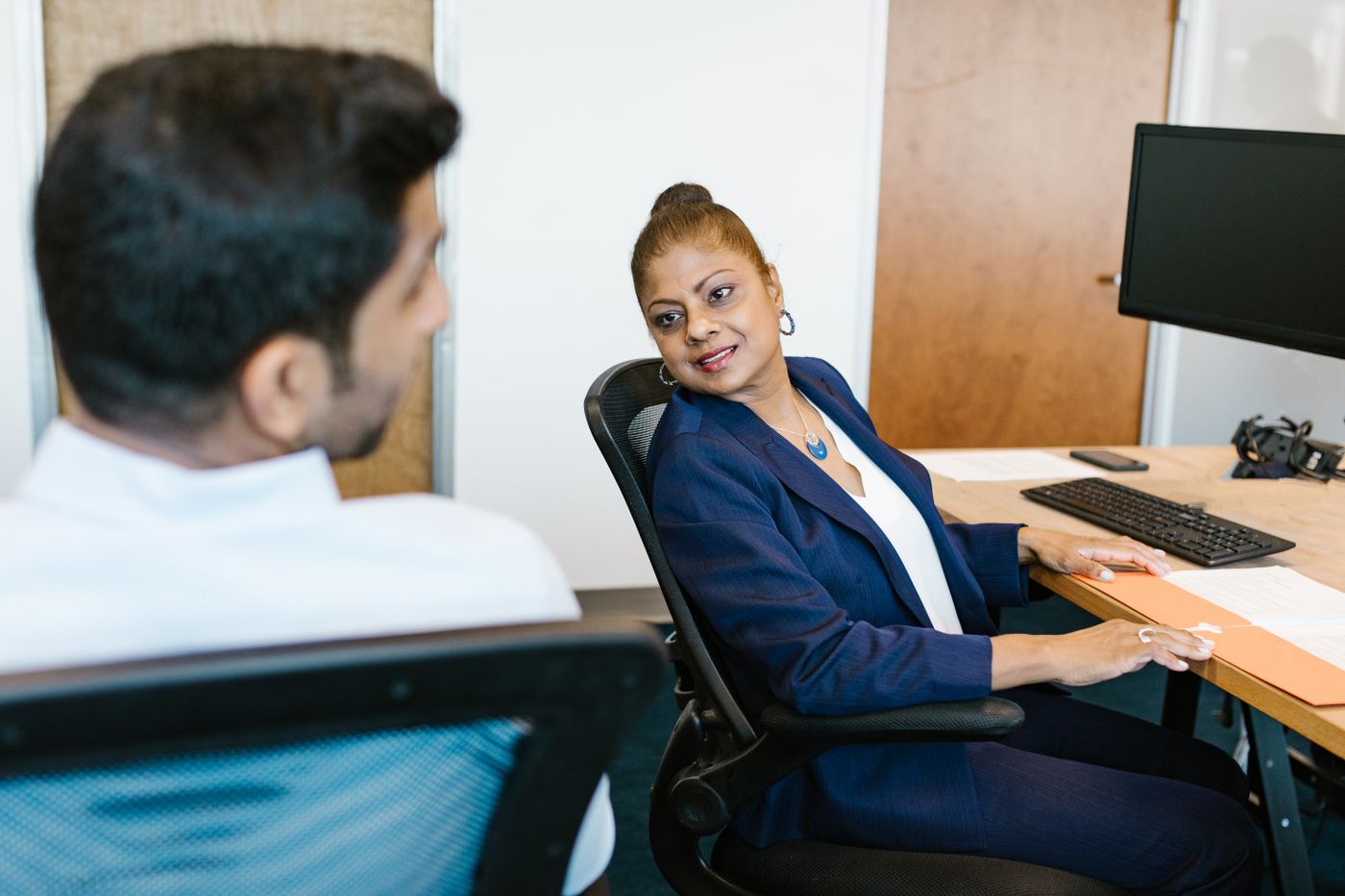 Two colleagues connecting marketing leads to CRM records
