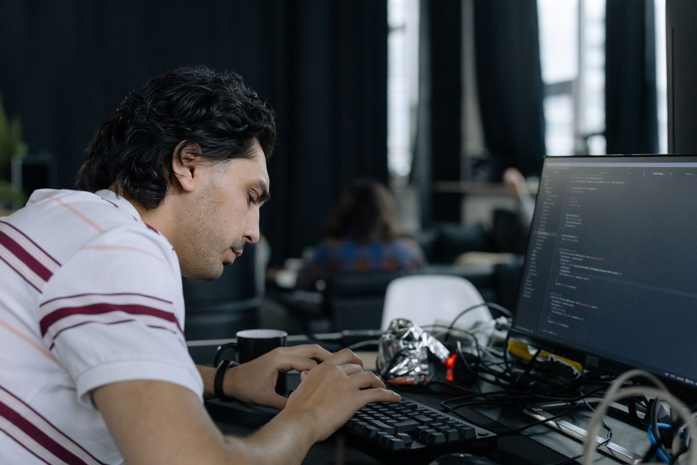 Engineer working through system updates at a workstation