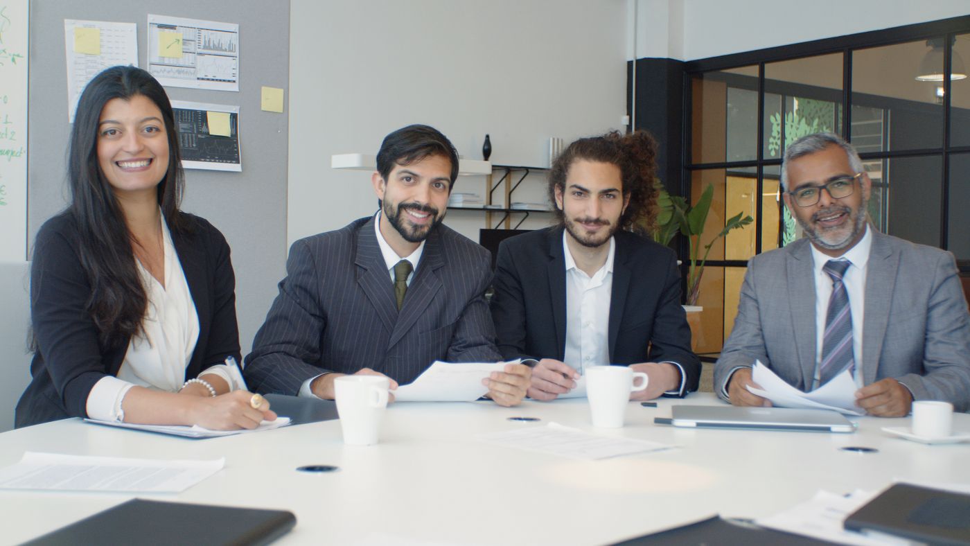 GCC leadership team seated together at a meeting table