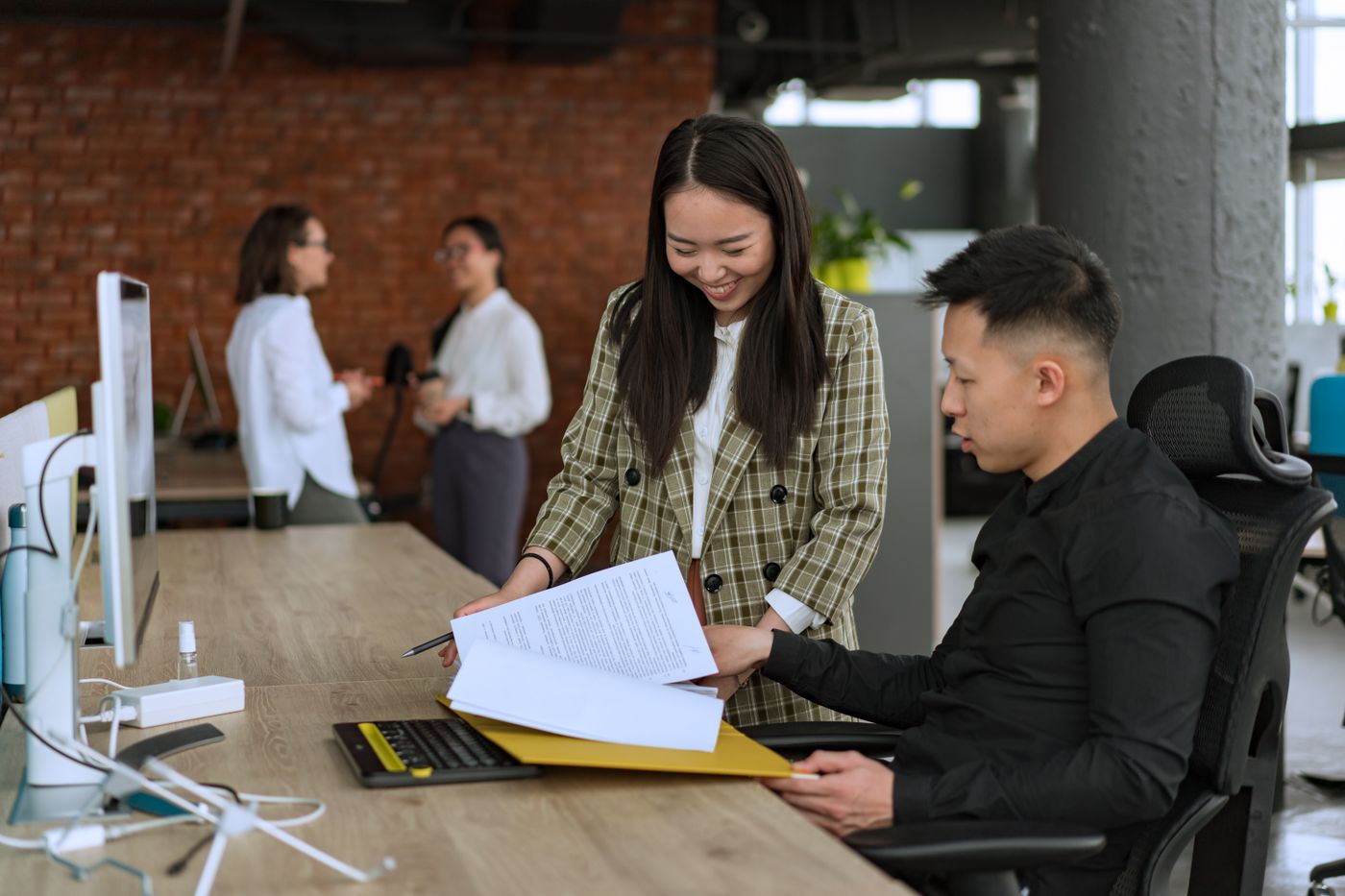 Professionals reviewing integration documents at a desk