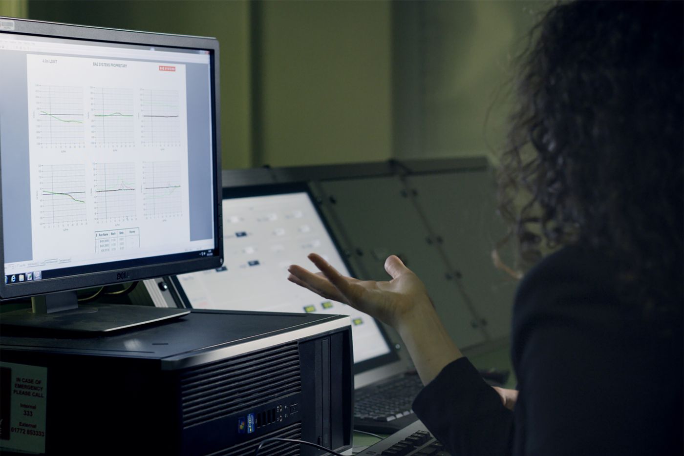 Analyst reviewing automated results on a monitor