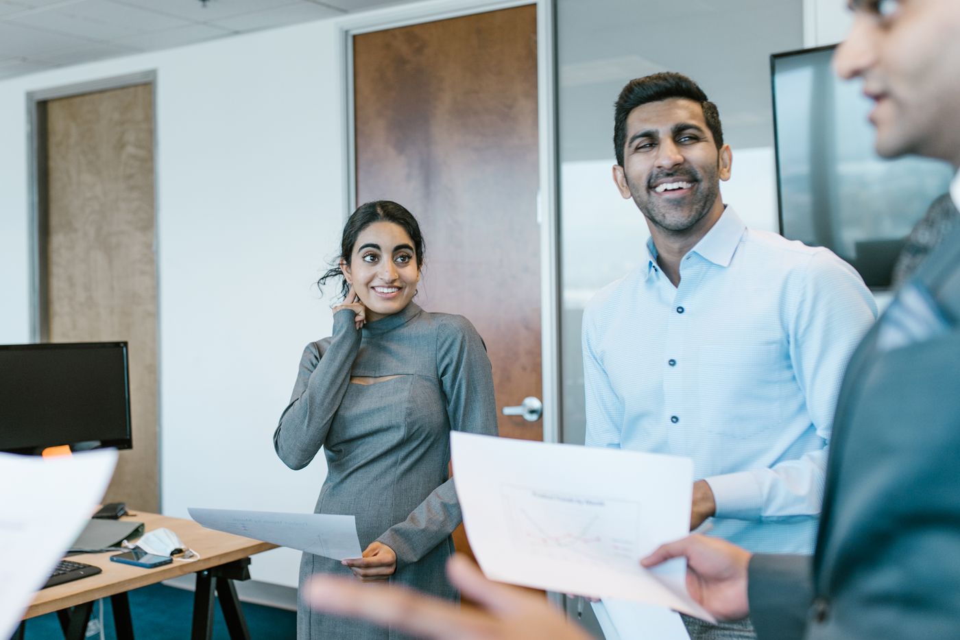 Two colleagues reviewing qualified leads in the office