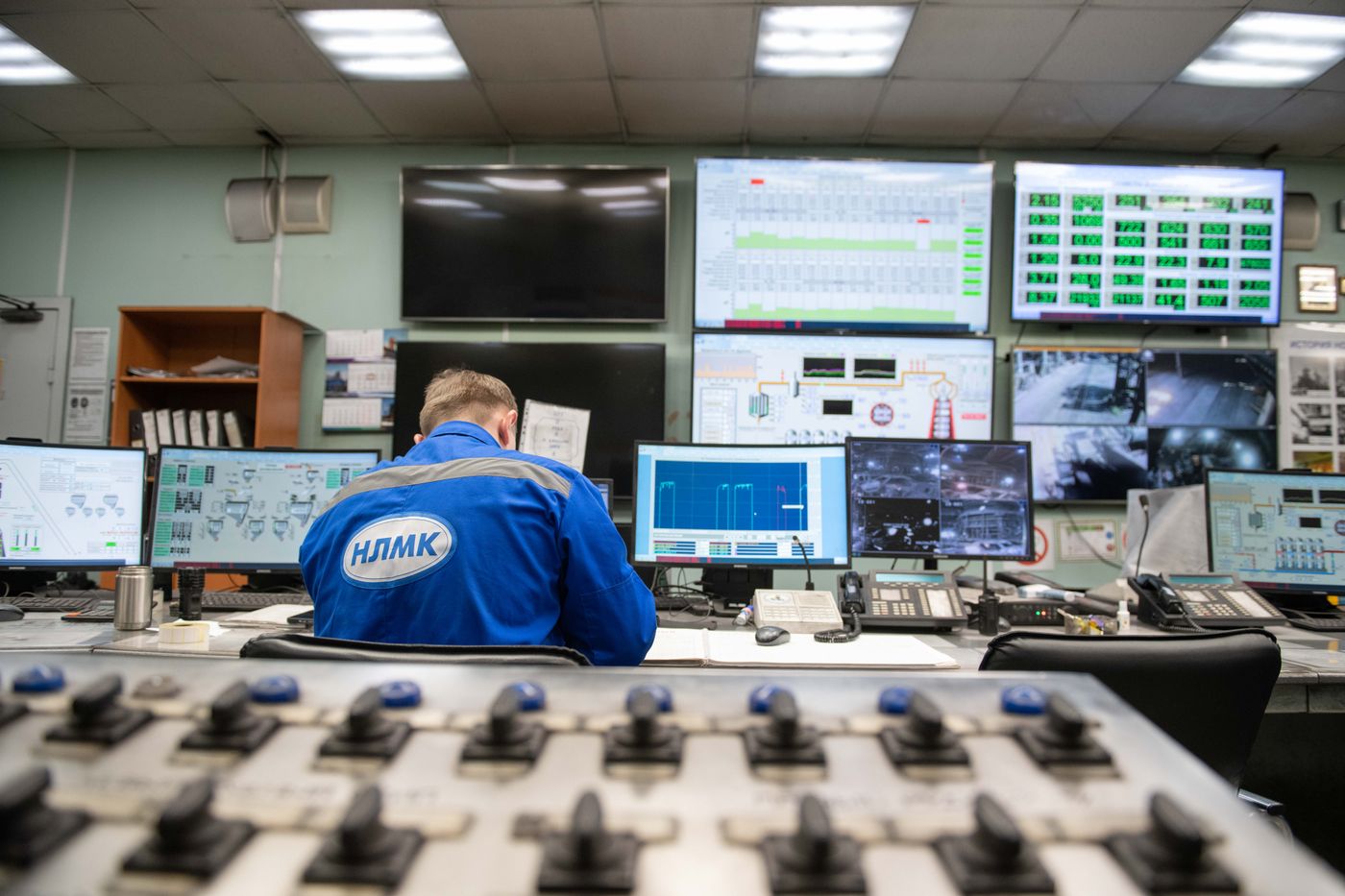 Engineer monitoring live workflows in a control room