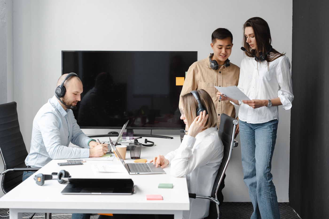Team coordinating a workflow across their desks