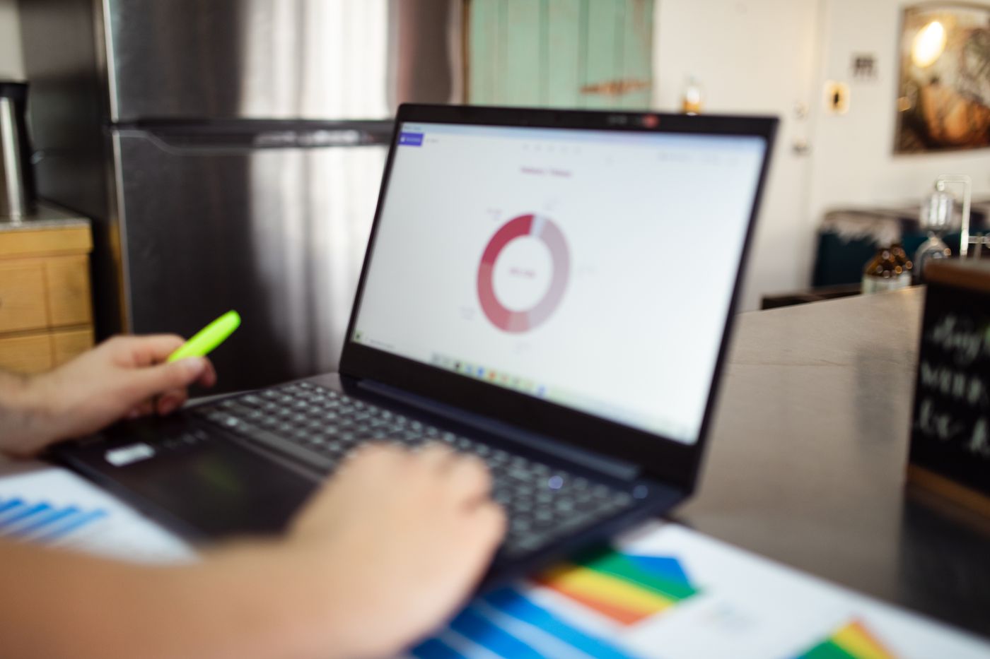 Marketer reviewing paid campaign results on a laptop