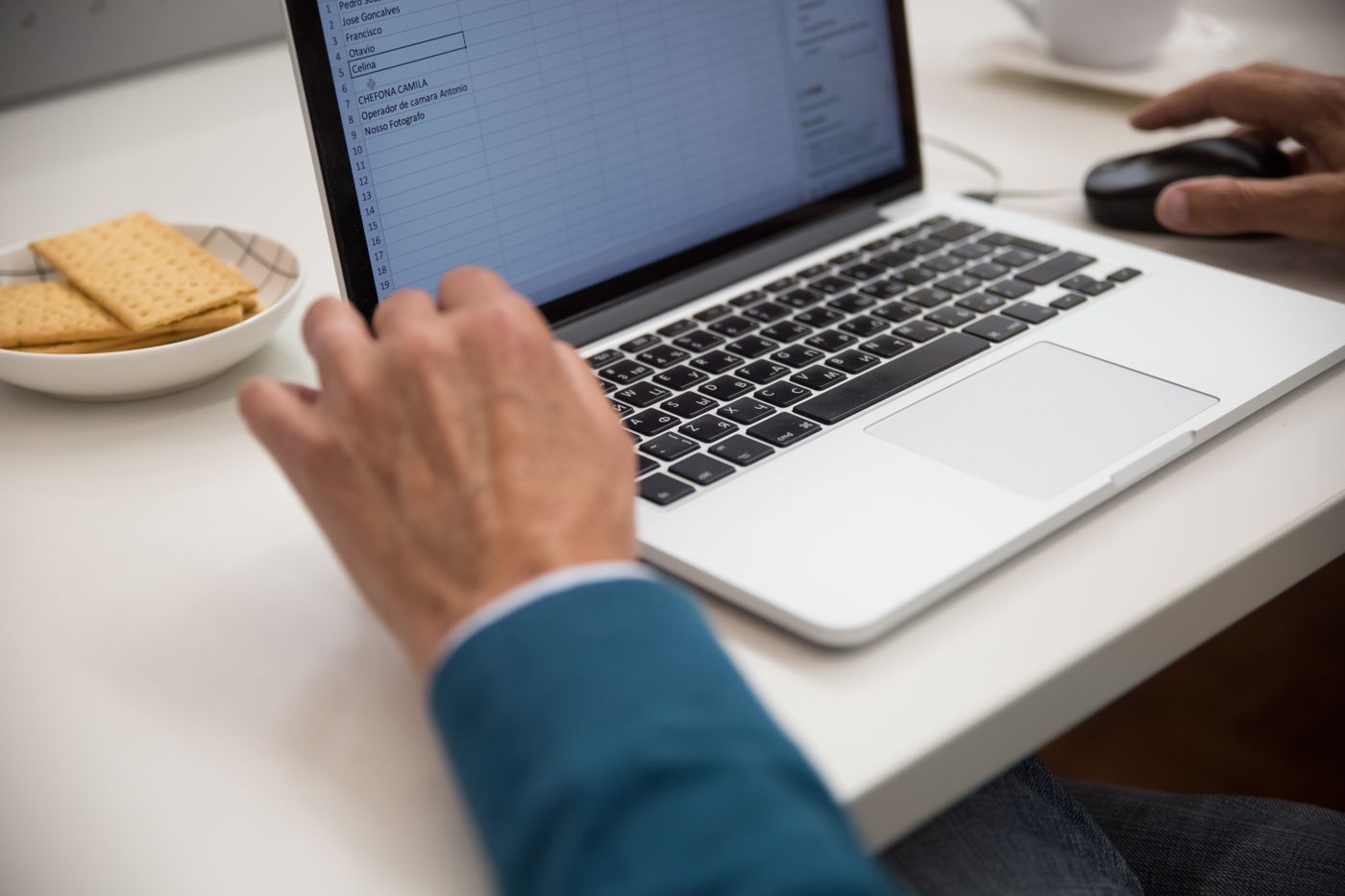 Marketer managing SaaS search campaigns on a laptop