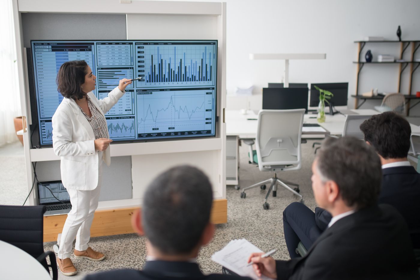 Engineer presenting performance results to the team