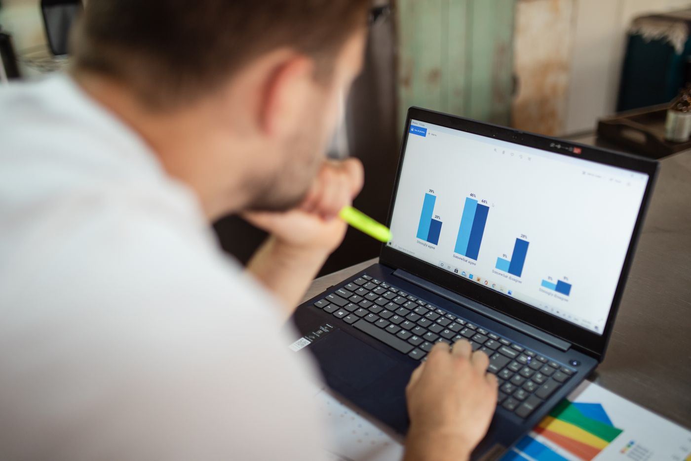 Marketer reviewing a performance report on a laptop