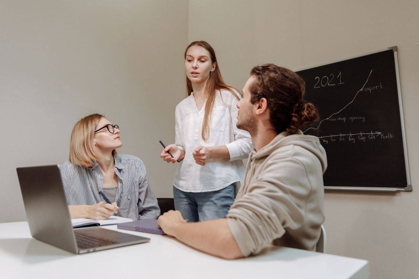 SaaS growth team planning an acquisition strategy at a chalkboard