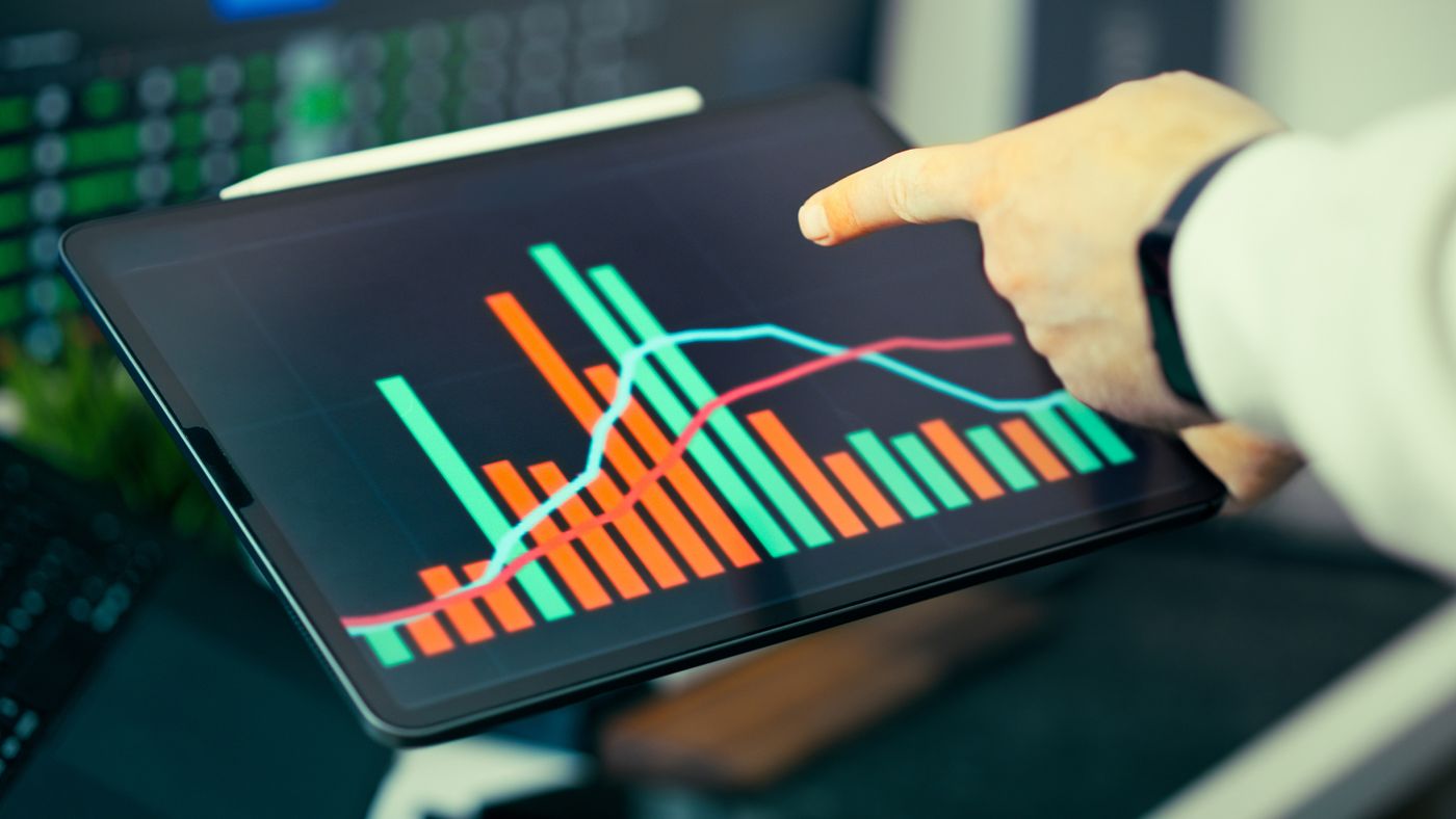 Analyst validating conversion data on a tablet
