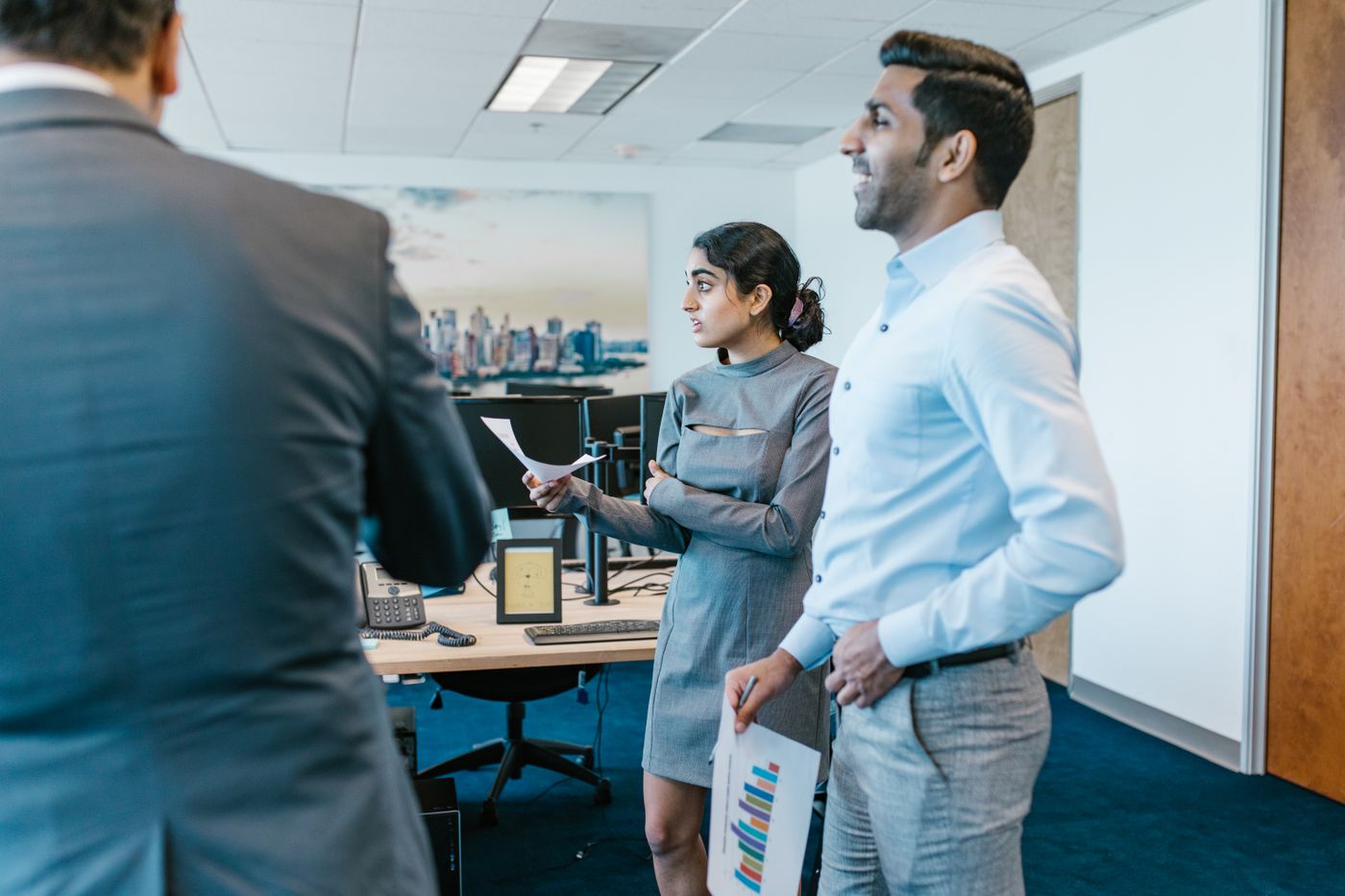 Sales lead and colleague setting up a new CRM in the office
