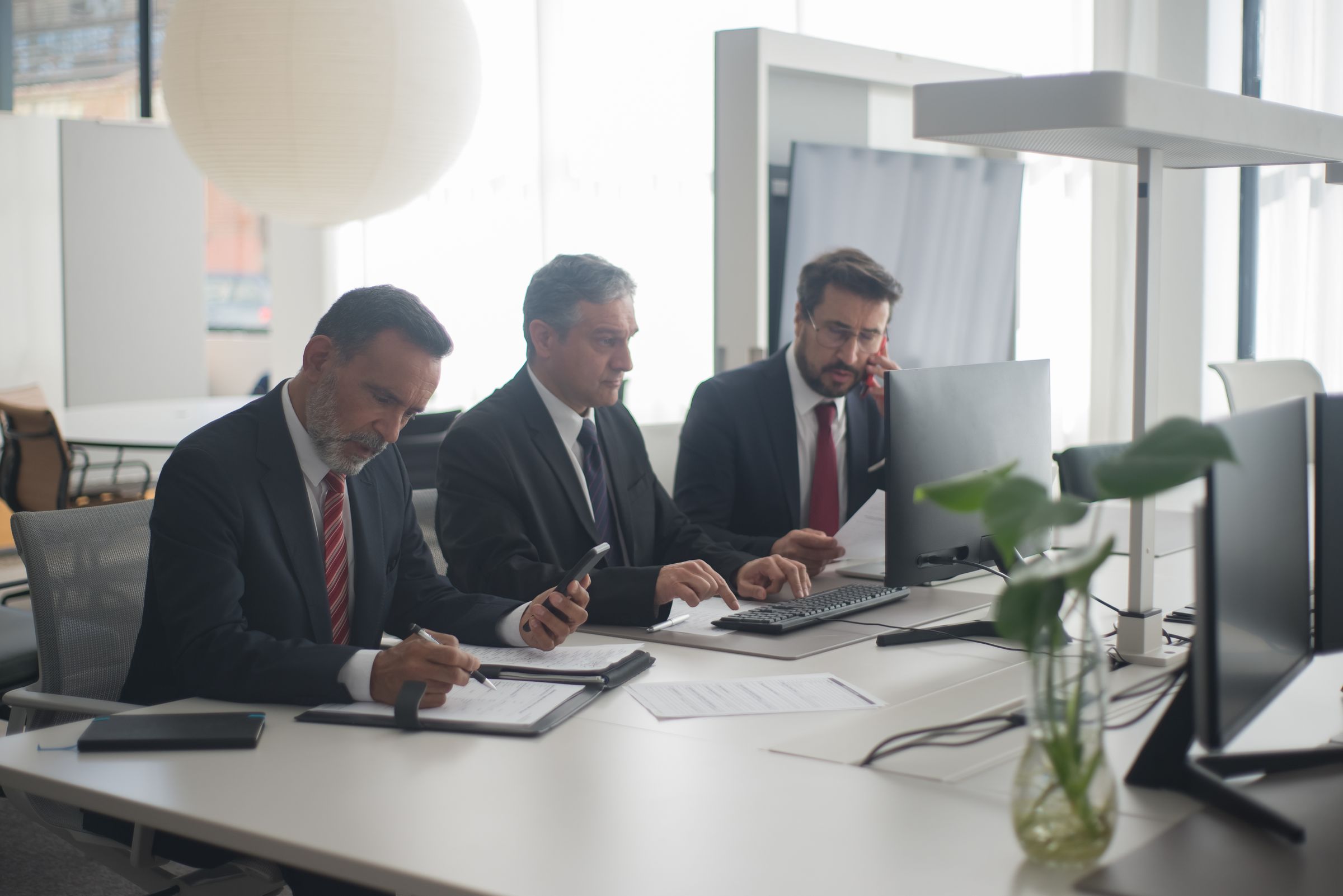 Bank staff working at their desks in an open-plan office