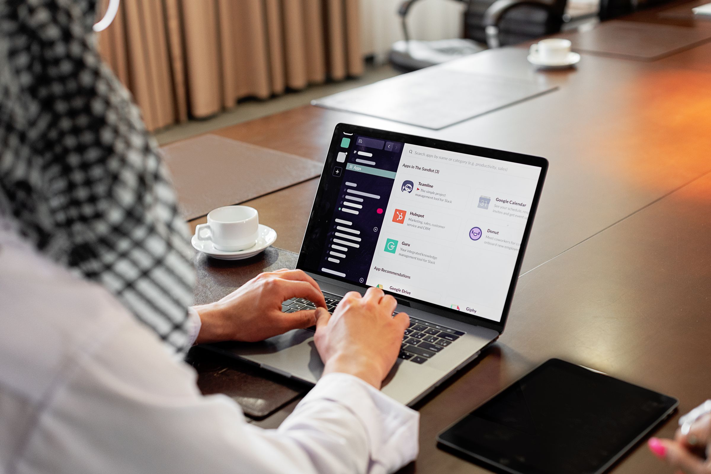 Professional working in a business app on a laptop