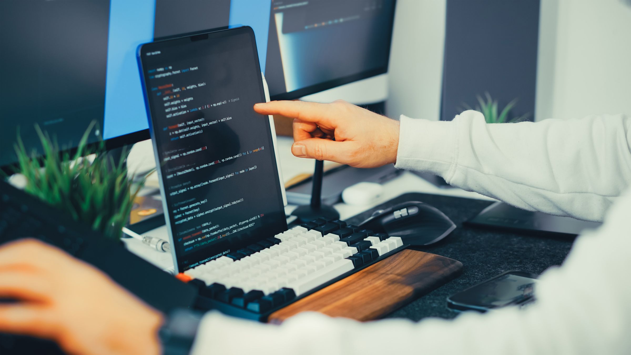 Engineer pointing out a line of code during review