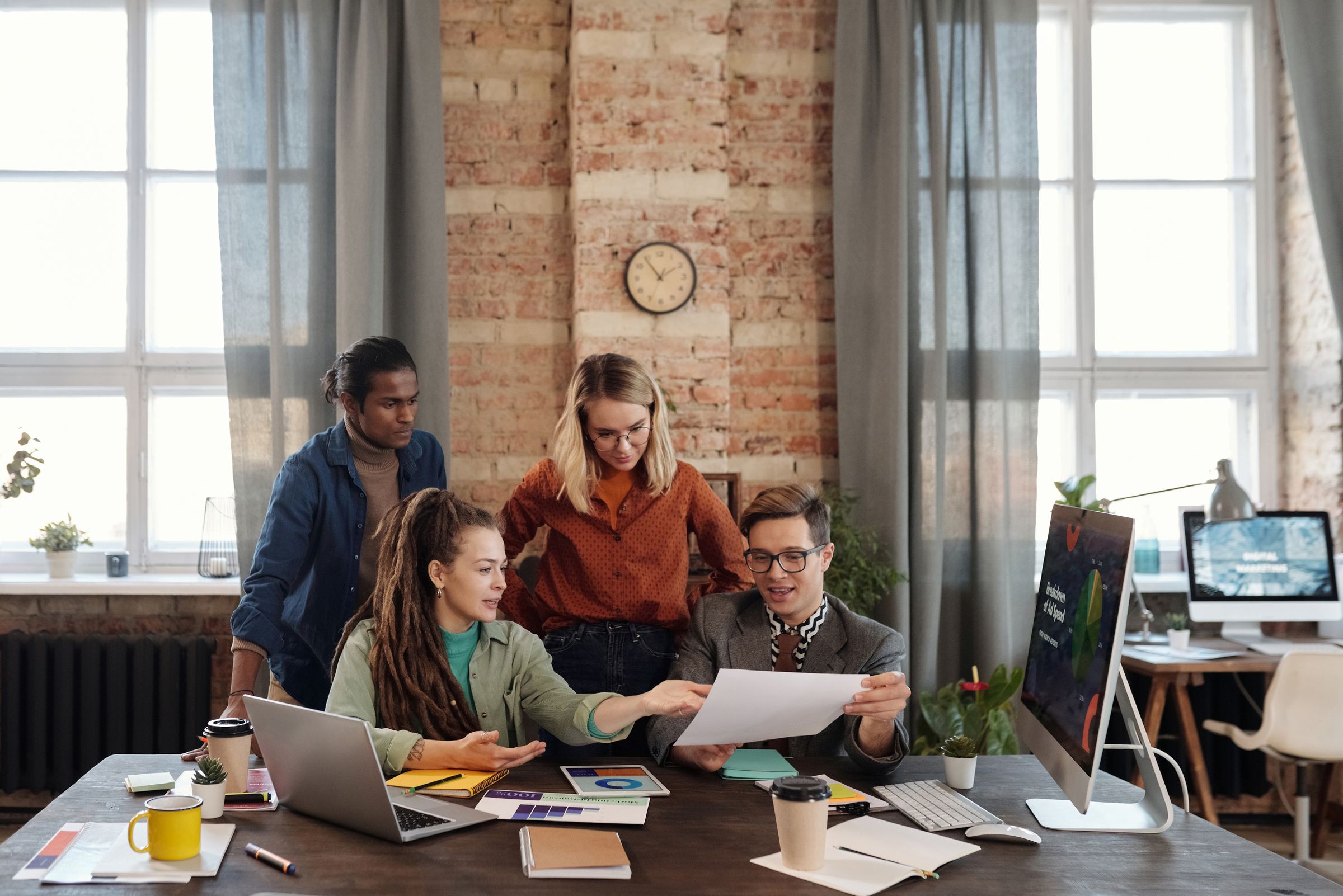 Marketing team planning a demand program around a table