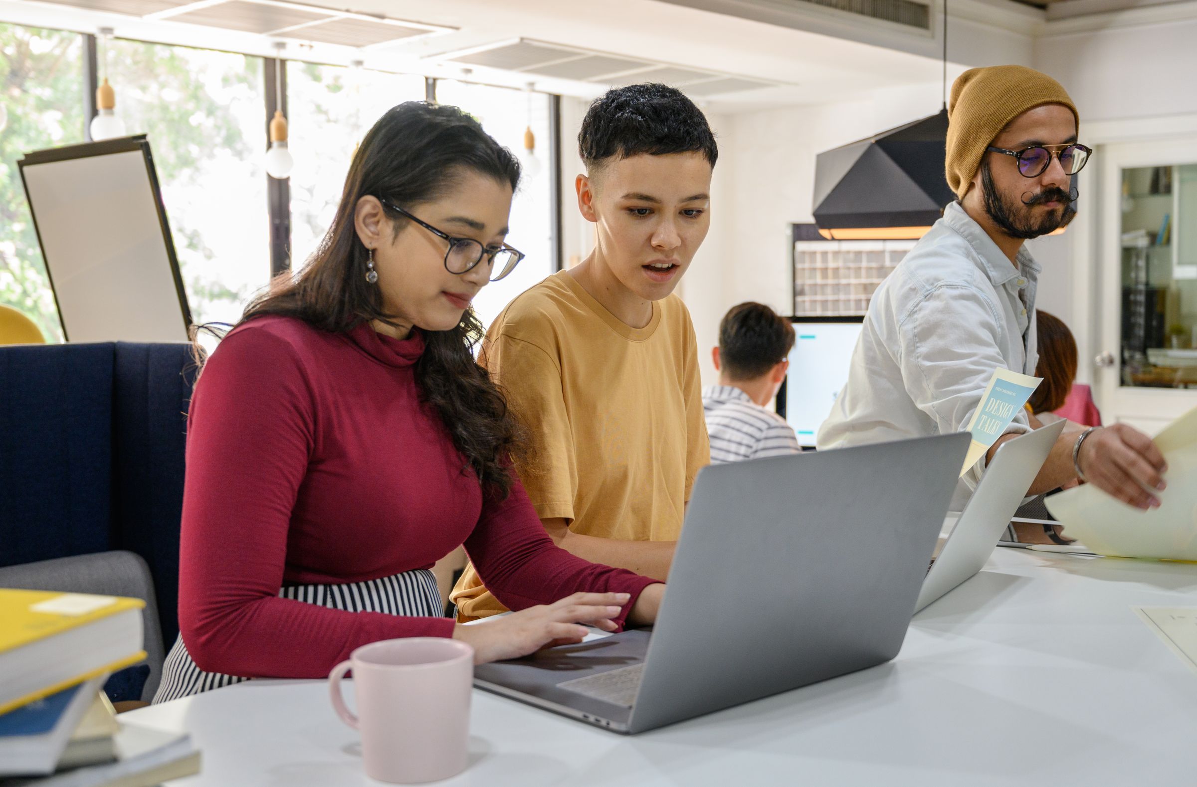 Product team working through their product on a laptop