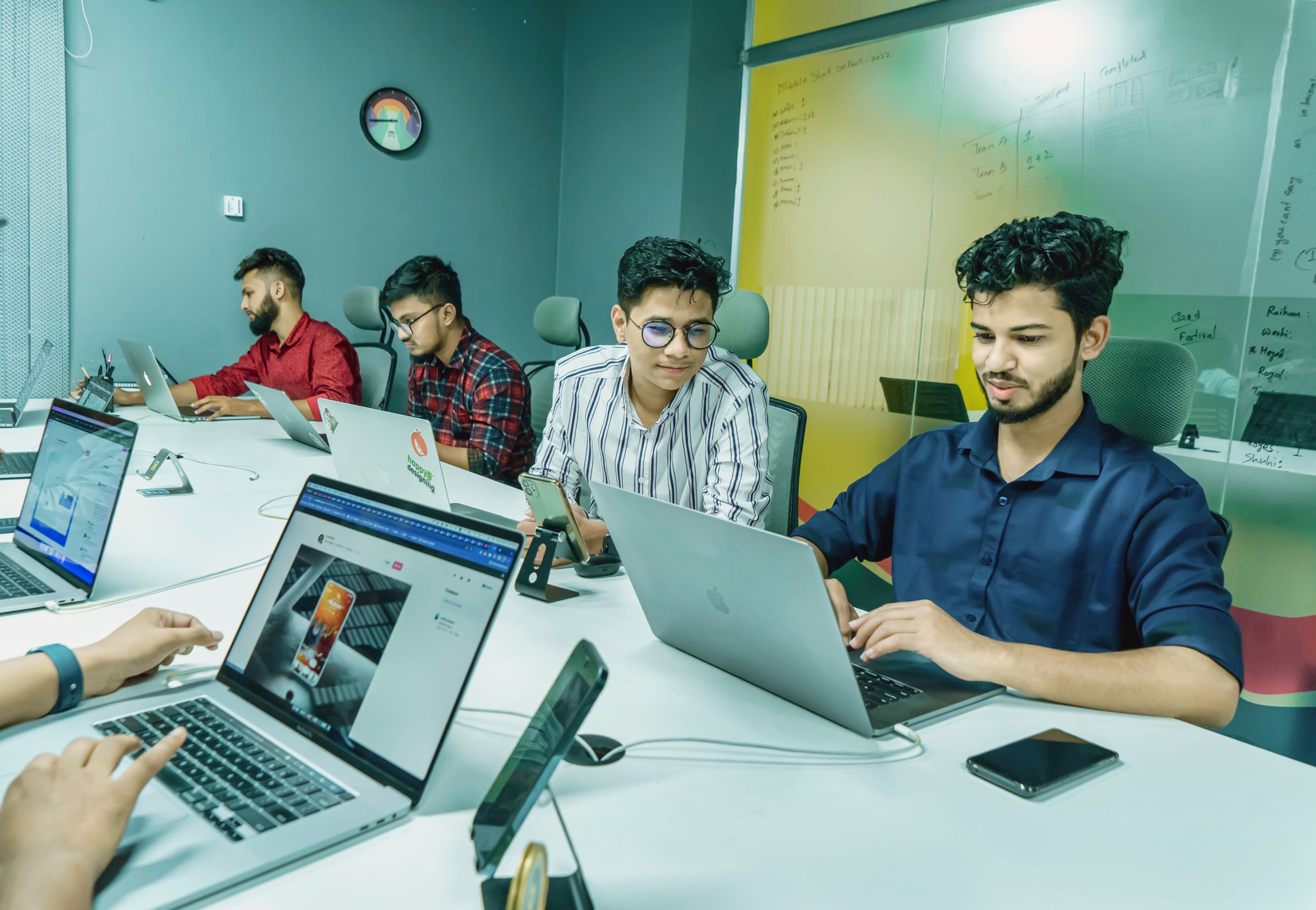 Revenue team working through automated workflows on their laptops