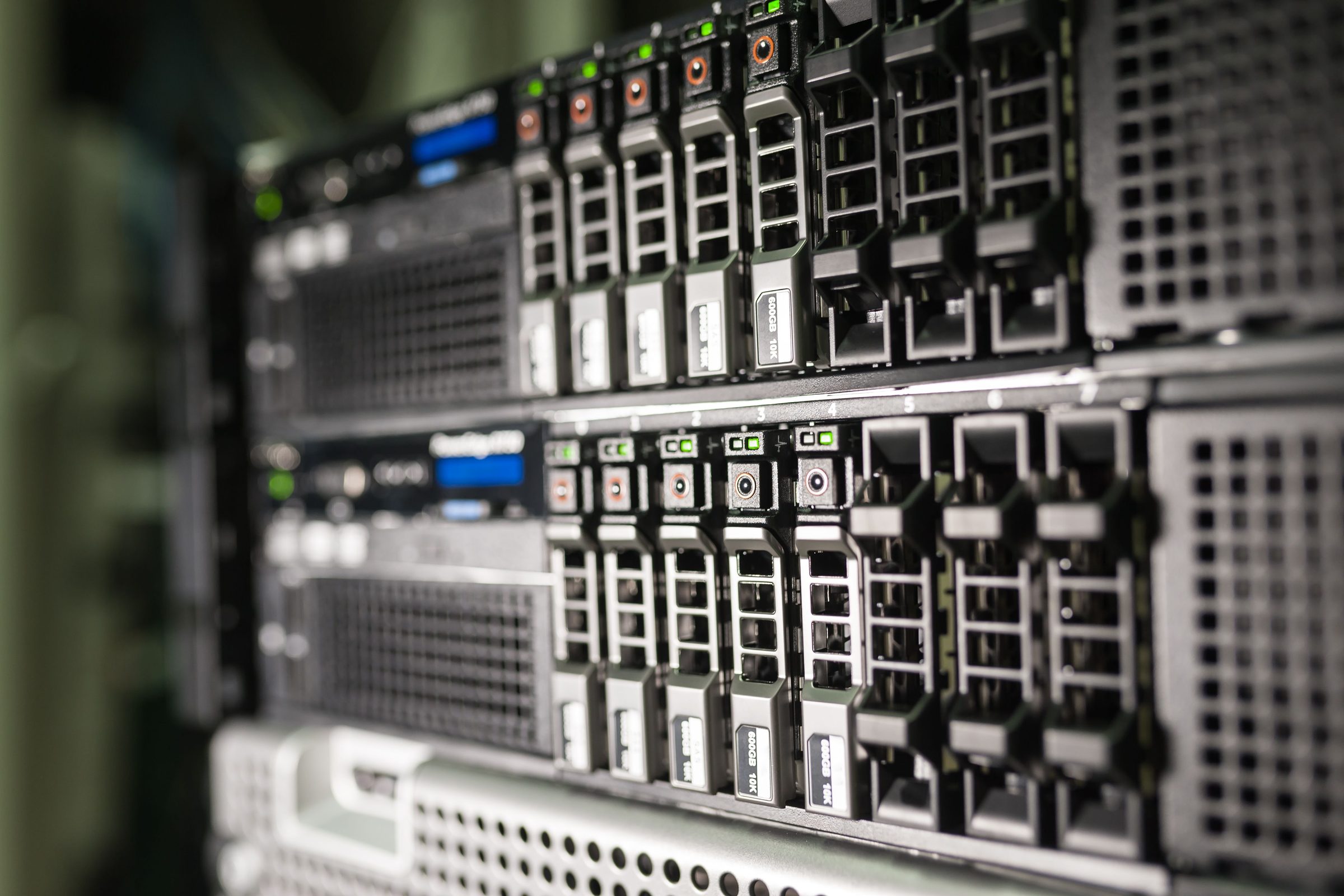 Cloud engineering: close-up of rack-mounted servers with drive bays and status lights