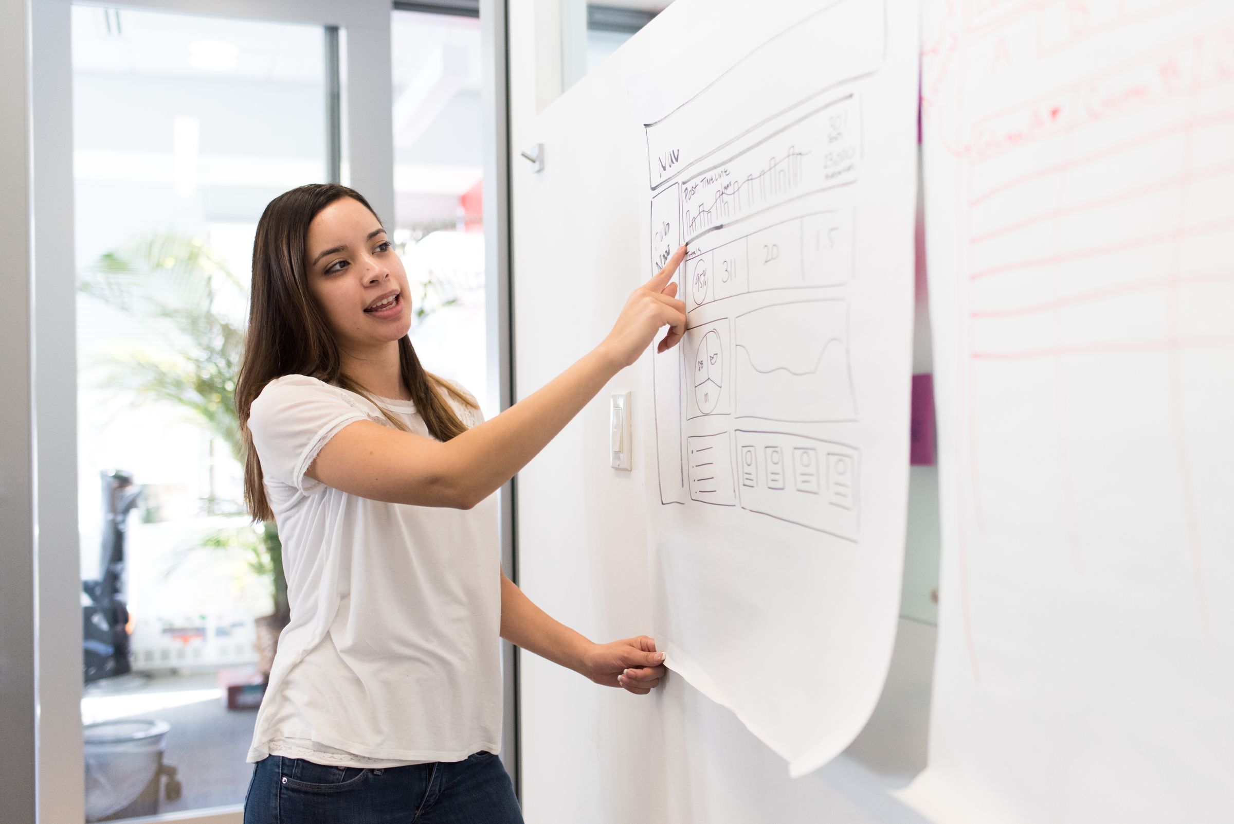 Designer walking through a landing page wireframe