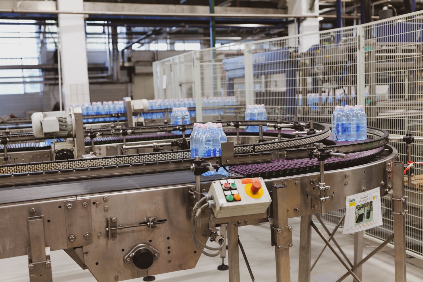 Bottled drinks moving along a production conveyor