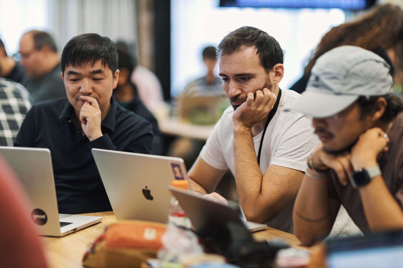 Software developers working together at laptops