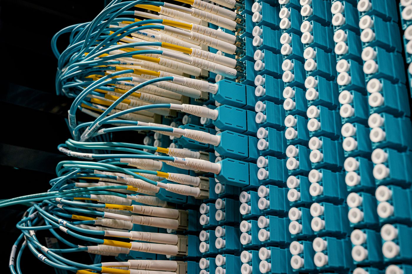 Fibre-optic cables connected into a dense patch panel