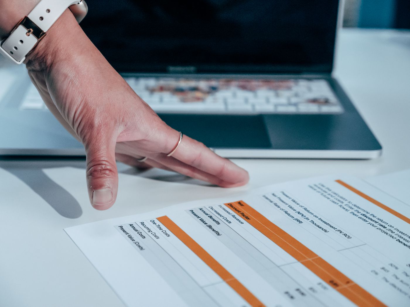 Analyst reviewing unified customer data on a laptop