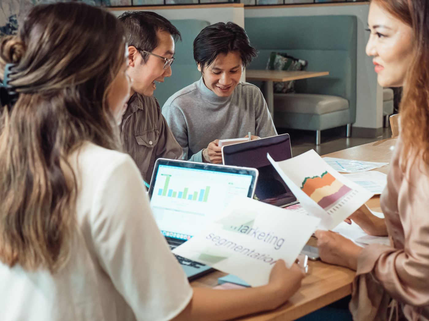 Marketing and sales colleagues reviewing results together