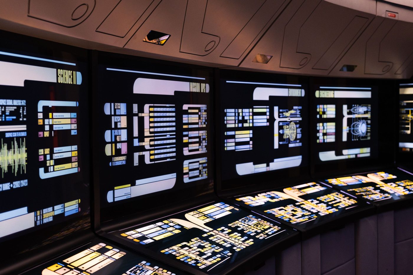 Operations console lined with monitoring displays