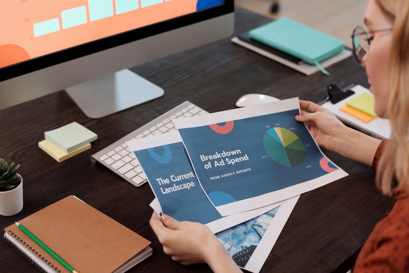 Marketers reviewing an ad spend breakdown for wasted budget