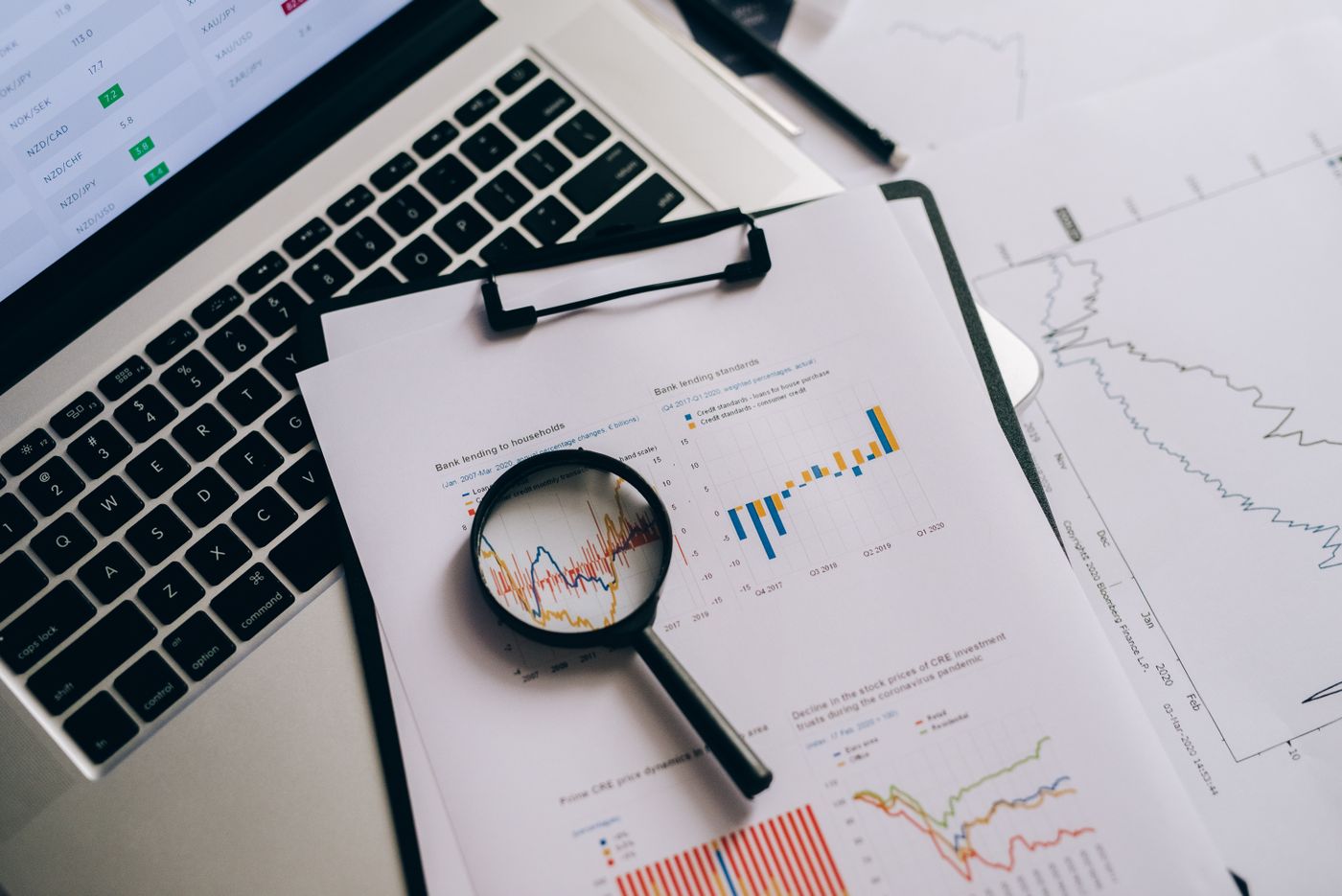 Attribution reports and charts beside a laptop