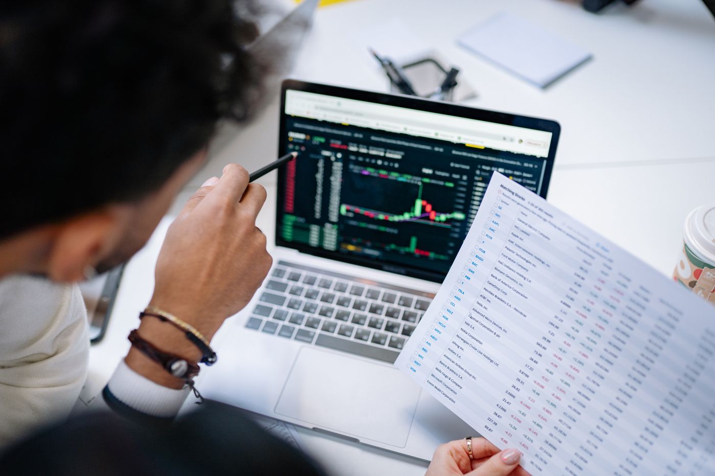 Salesperson reviewing automated pipeline reports on a laptop
