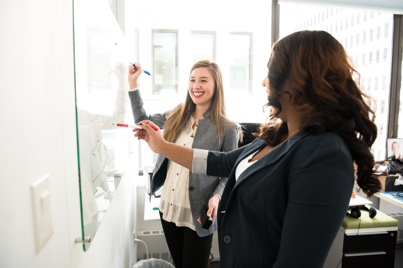 Team planning a delivery roadmap together at a whiteboard