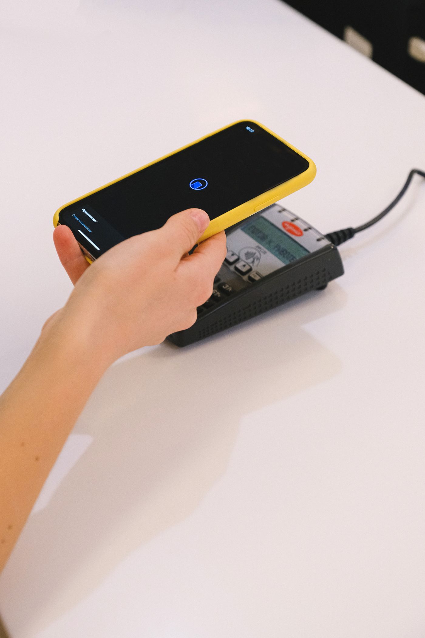 Phone being tapped on a card payment terminal