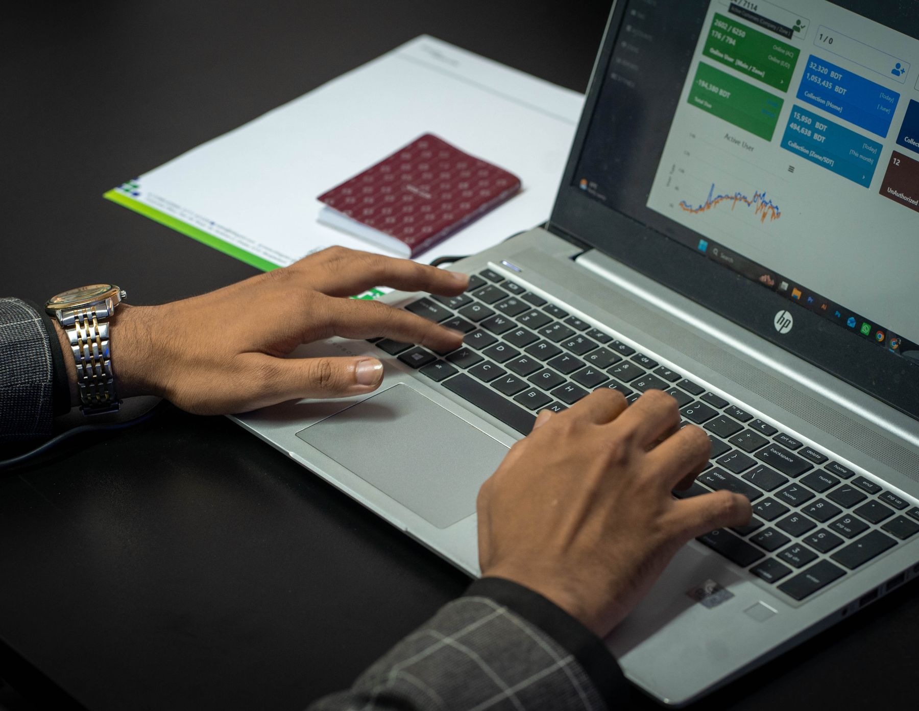 Sales professional reviewing a CRM dashboard on a laptop